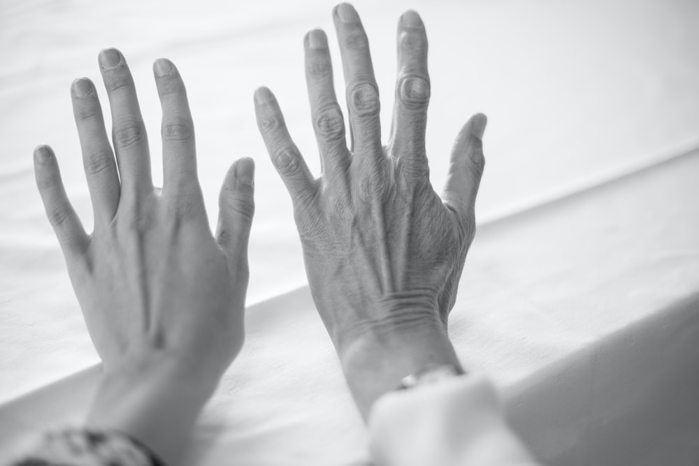 Comparison of a young person’s hand with an older adult’s hand for family history research