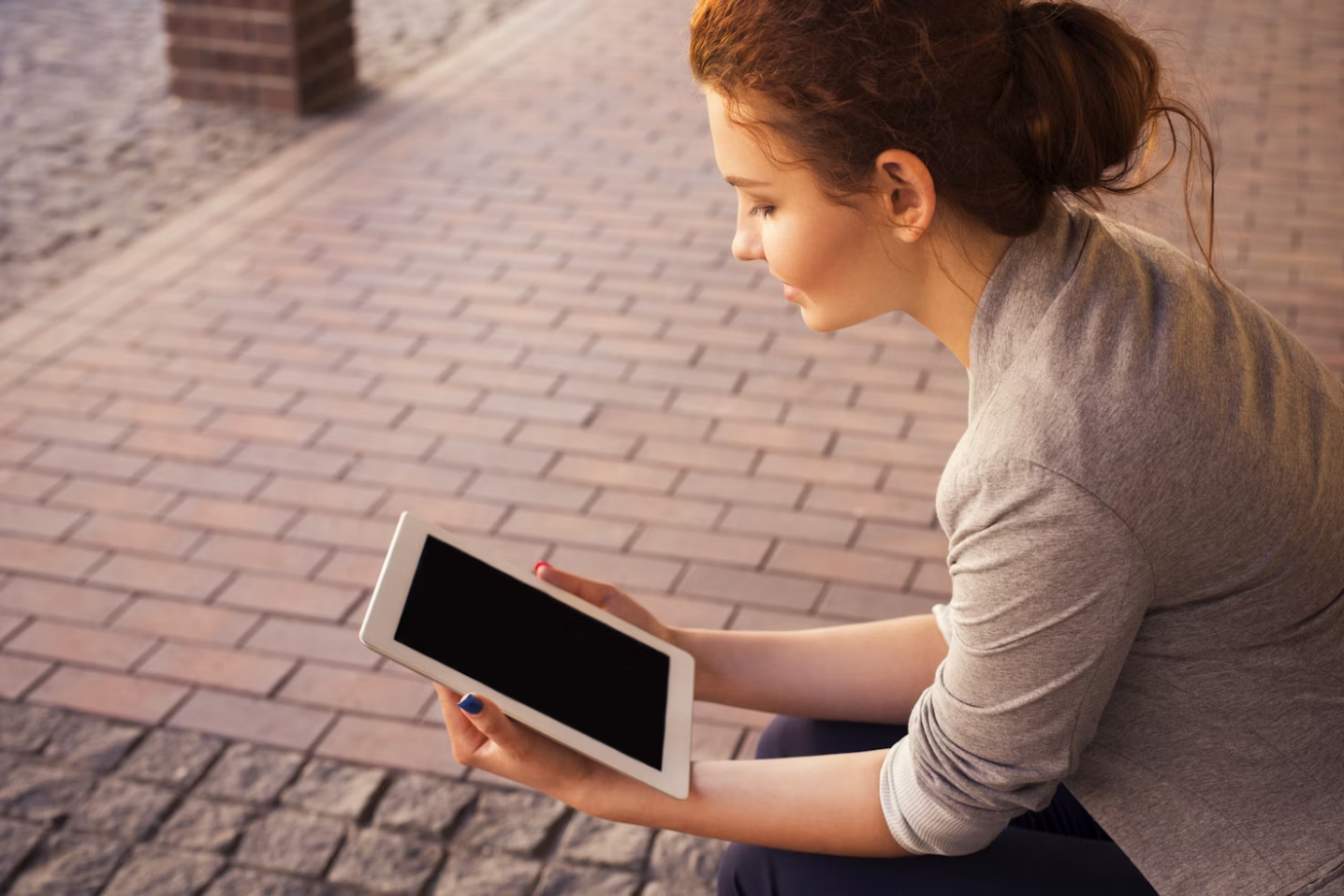 a woman holding a device.