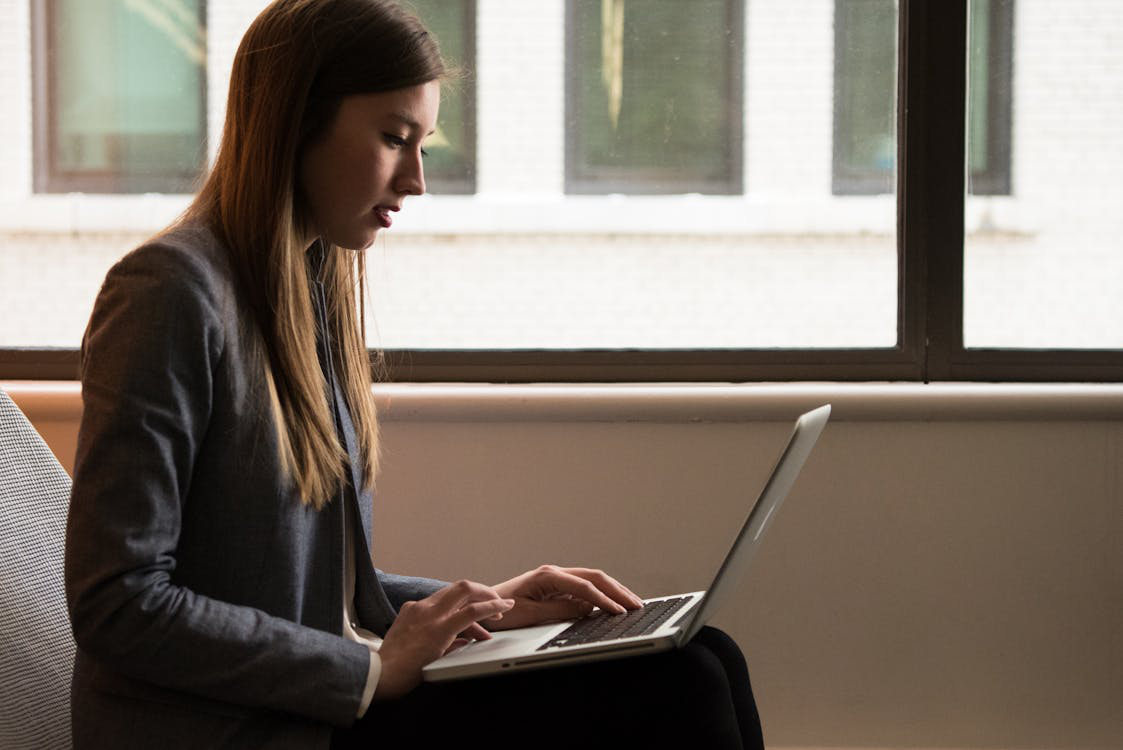 a woman sitting by the window.