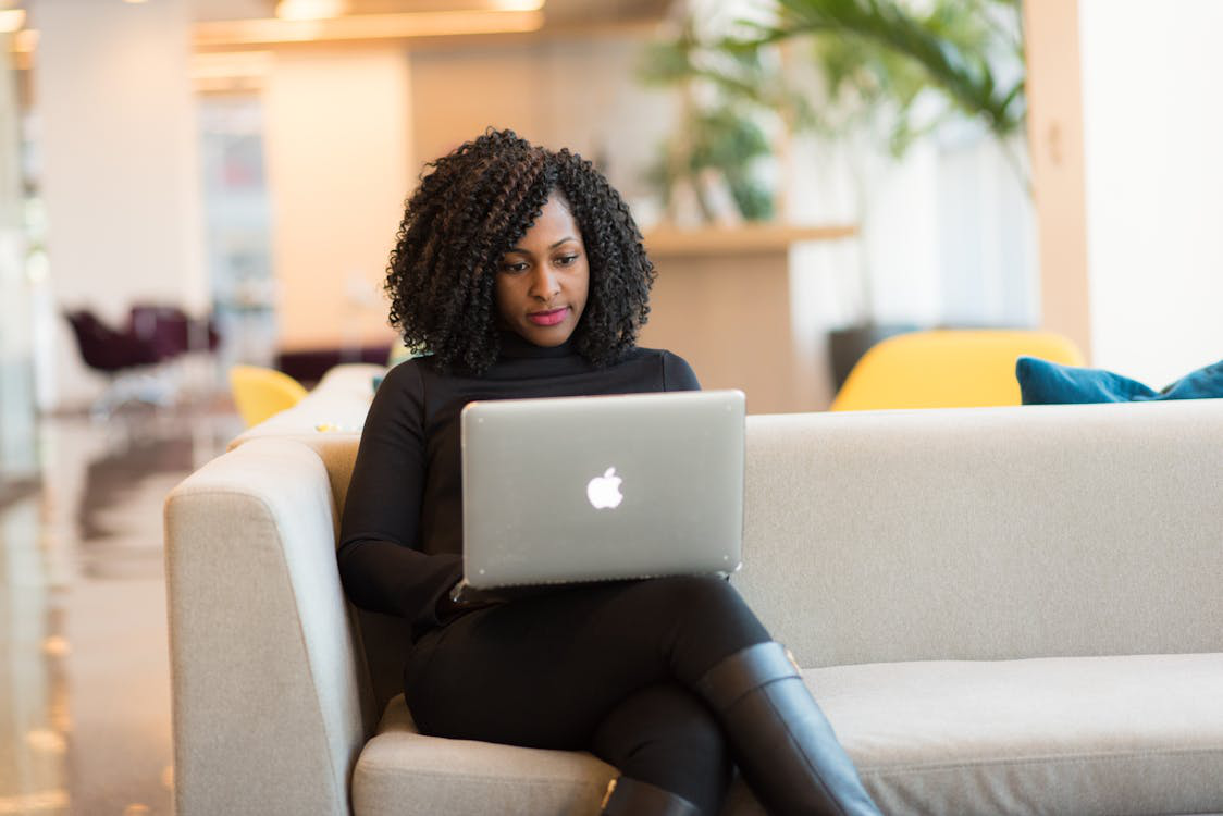 a woman using a MacBook