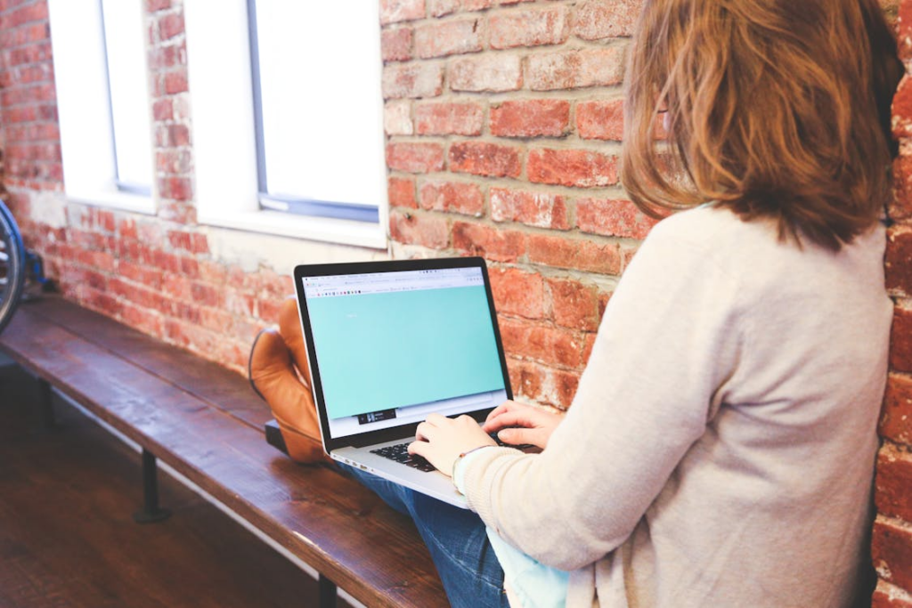 a woman using her computer.