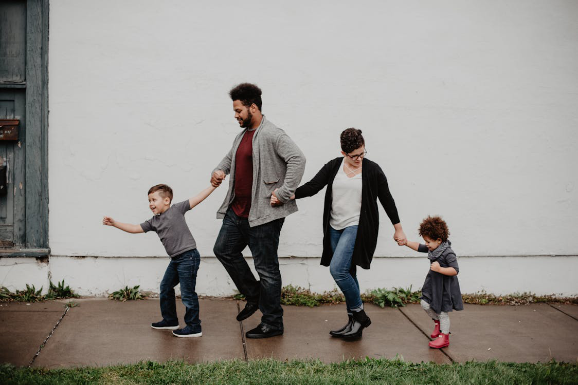 a family holding hands.